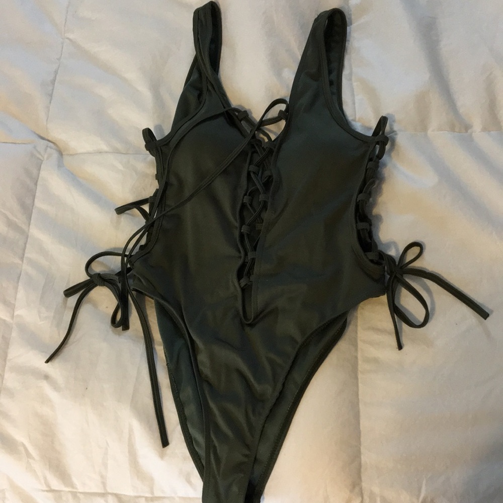 Hunter green, lace up, high leg one piece swimsuit
